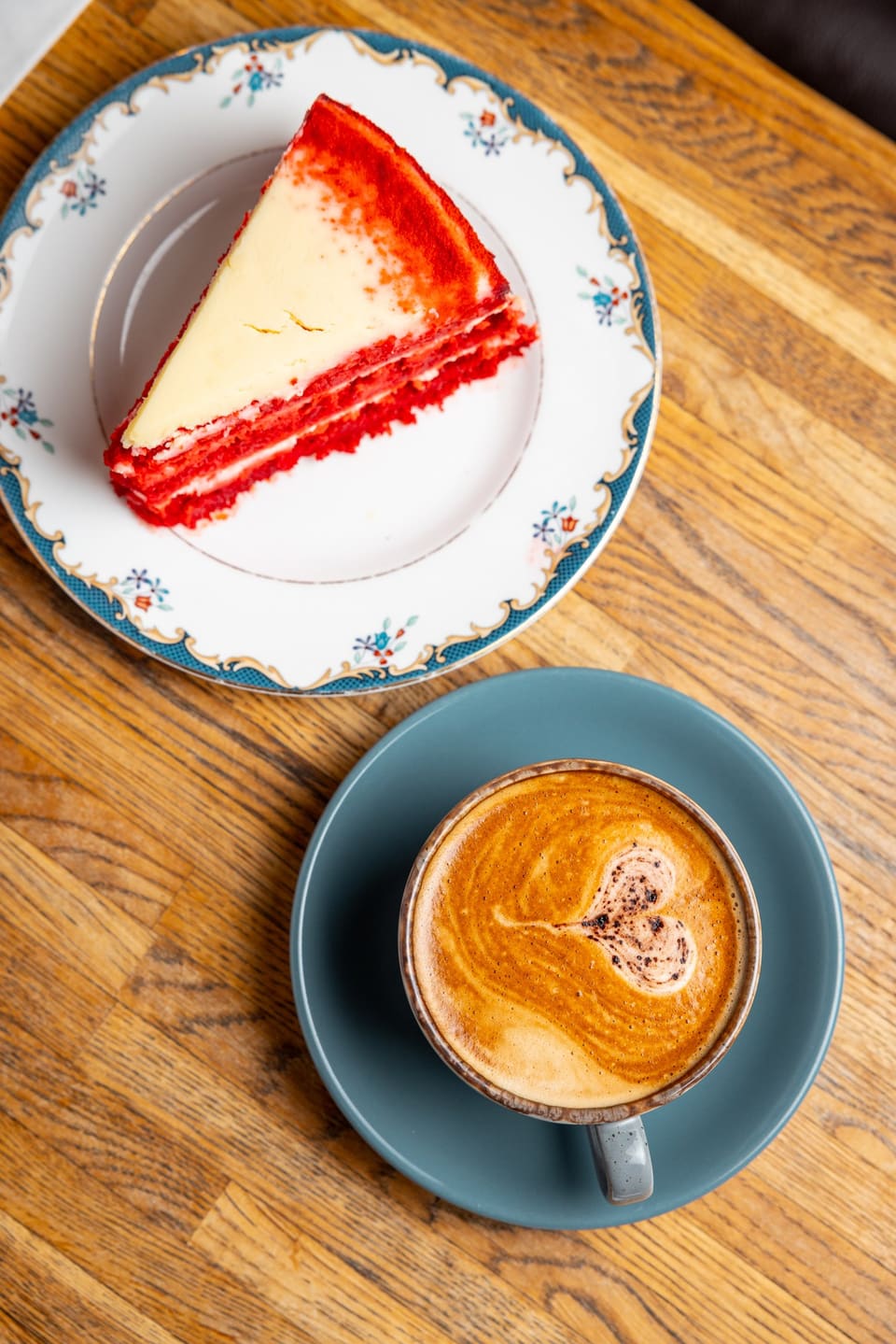 Red velvet cake with a flat white
